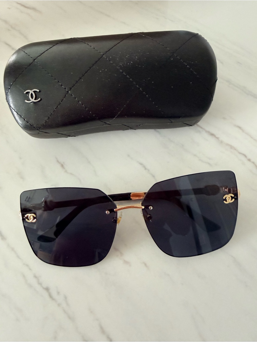 Women's Black Rimless Square Sunglasses with Gold Accents